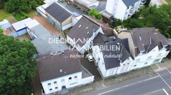Hauptbild Kapitalanlage mit Entwicklungspotenzial - Mehrfamilienhaus mit 9 Wohneinheiten und 6 Garagen